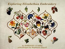 A photo of the cover of a book published in NZ in 1997 showing ten different stitched flowers each in a section of 'bauble' shaped stitched trellis