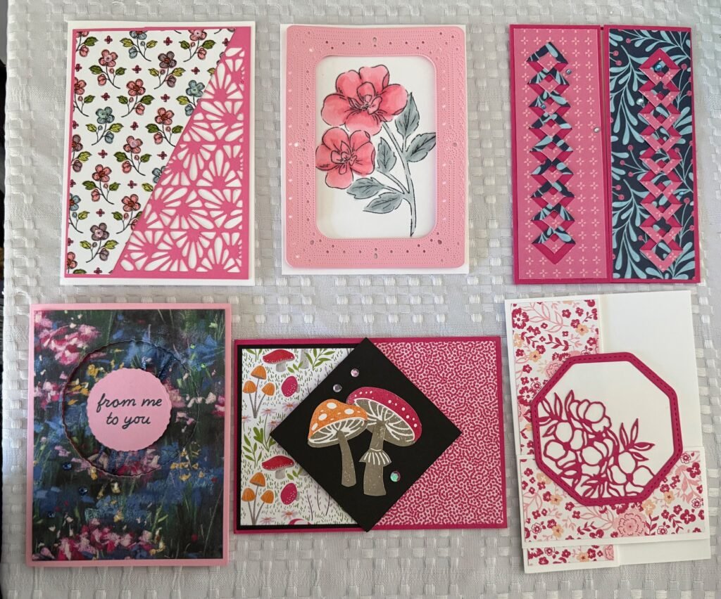 a collection of six greeting cards, each different styles and folds , all featuring pink decorative papers , pictures and embellishments.