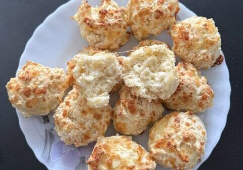 A plate of golden baked cheese scones